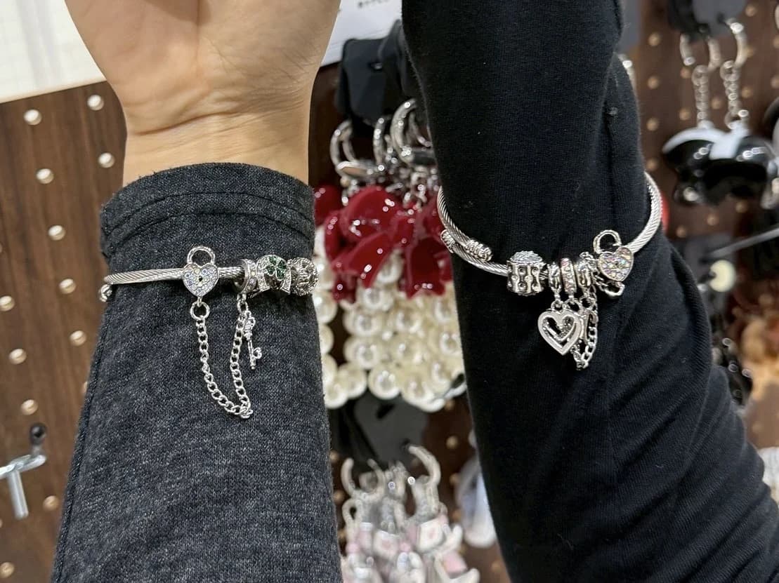 Two friends wearing custom snake bracelets at LuvLab