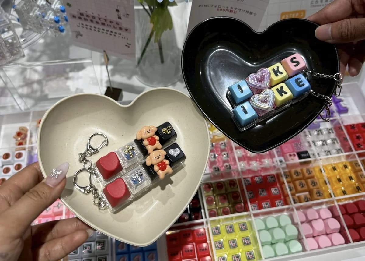 Finished custom keyboard keychains in heart-shaped trays
