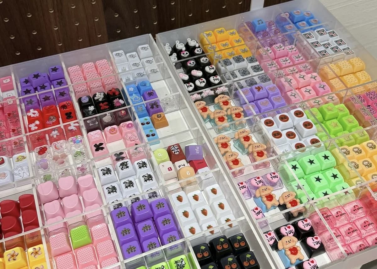 Colorful mechanical keycaps organized in display trays at LuvLab Harajuku