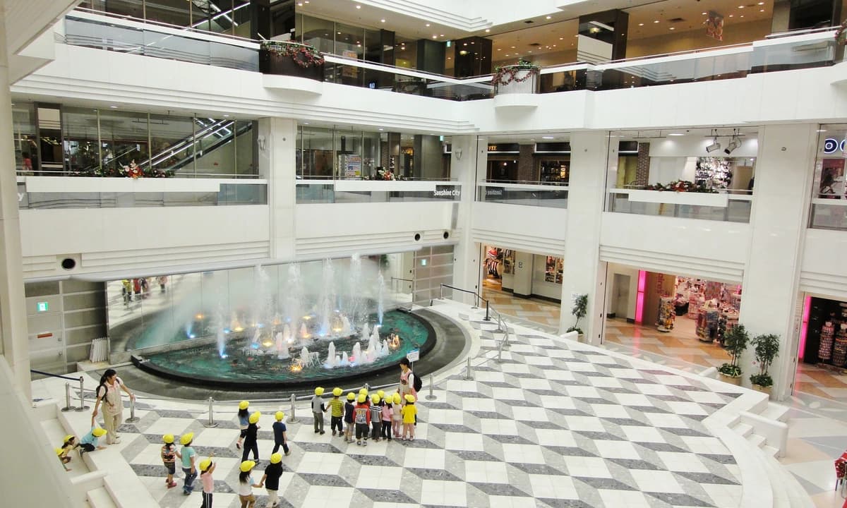 Sunshine City atrium fountain interior in Ikebukuro — the Toshima-ku complex hosting Exhibition Hall A on the 4F World Import Mart Building, the Ranma 1/2 2026 exhibition venue