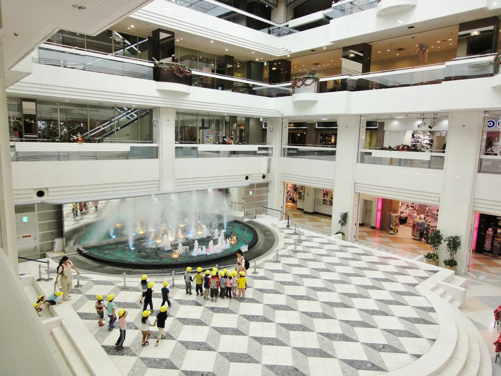 Sunshine City atrium in Ikebukuro — a neighborhood landmark a short walk from the Sandwich Diner DECOTTO waffle collab venue