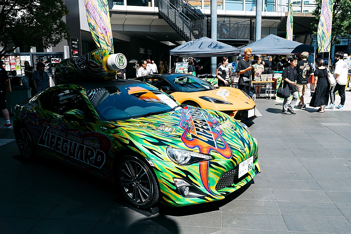 Itasha (anime-decorated sports cars) parked on display in Akihabara, an otaku subculture artifact