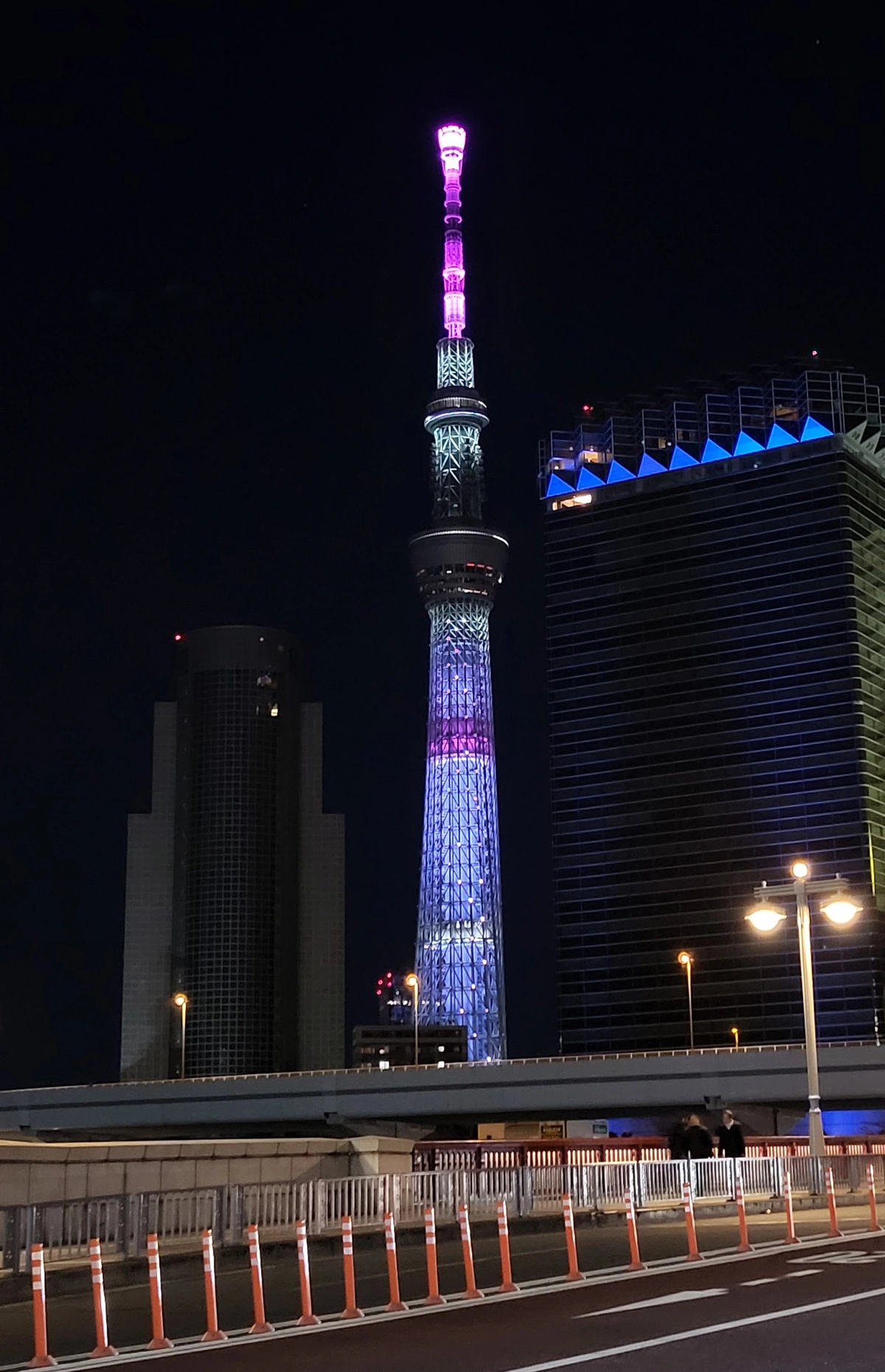 Tokyo Skytree at night, venue exterior view from street level, host site of the 2026 BLUE LOCK EPISODE SKY event
