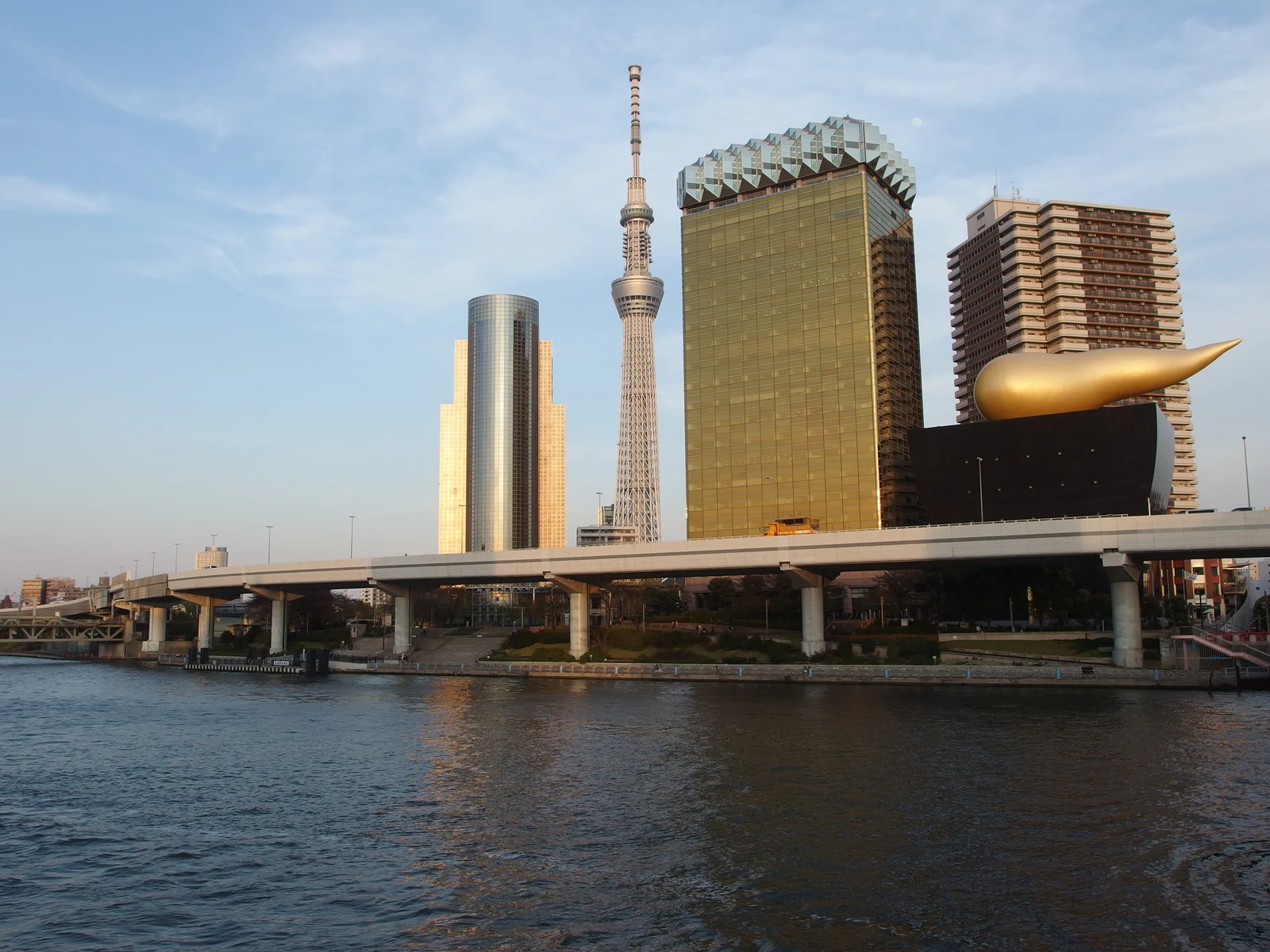 Tokyo Skytree across the Sumida River near Asakusa with the Asahi Beer headquarters in the foreground
