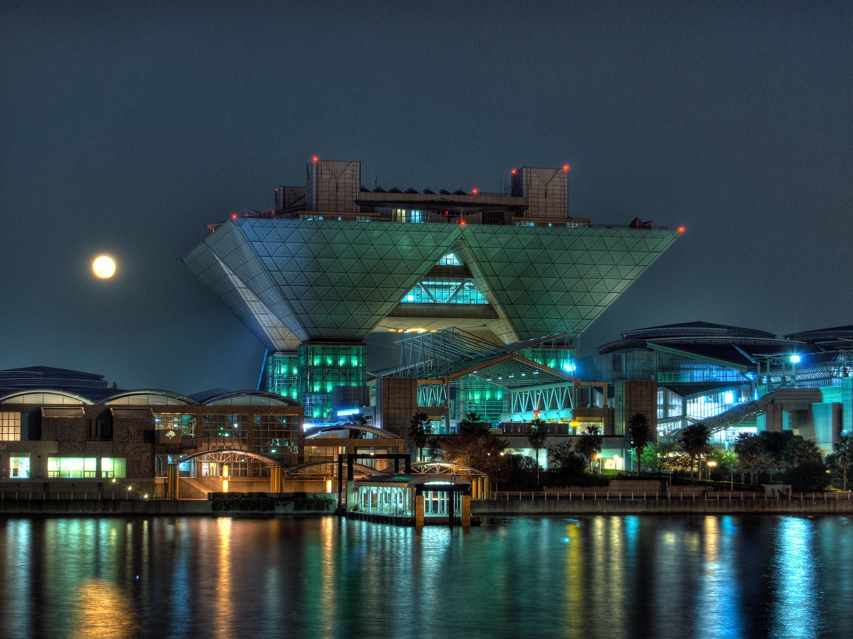 Tokyo Big Sight convention center at night, the venue for Comiket and many anime events you can book from overseas
