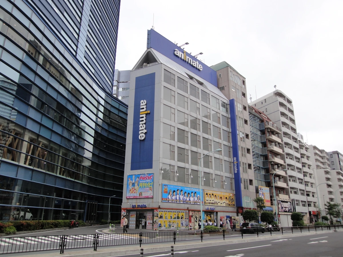 Animate Ikebukuro flagship anime merchandise store exterior in Tokyo, the kind of merch hub Demon Slayer fans pair with the ufotable Cafe Handmade Club run