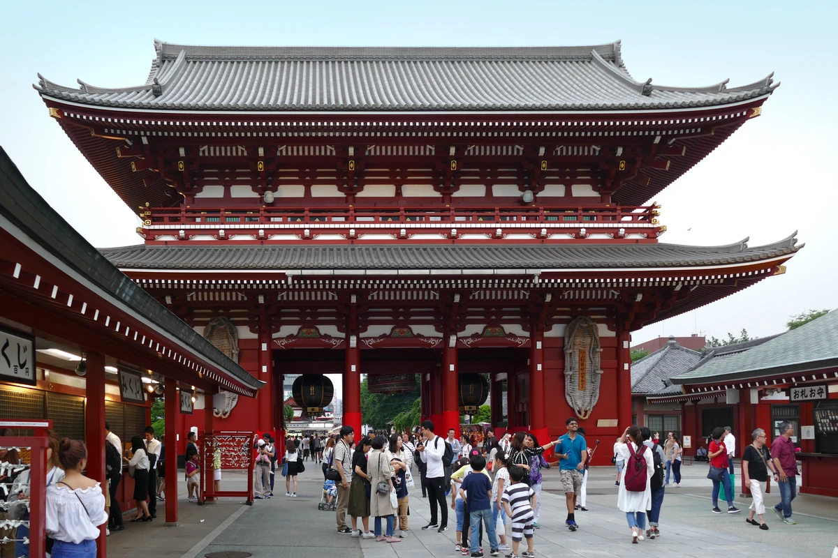 Senso-ji Temple complex in Asakusa with the five-story pagoda and main hall, the Taisho-era backdrop the anime renders for the Tanjiro and Nezuko sequences