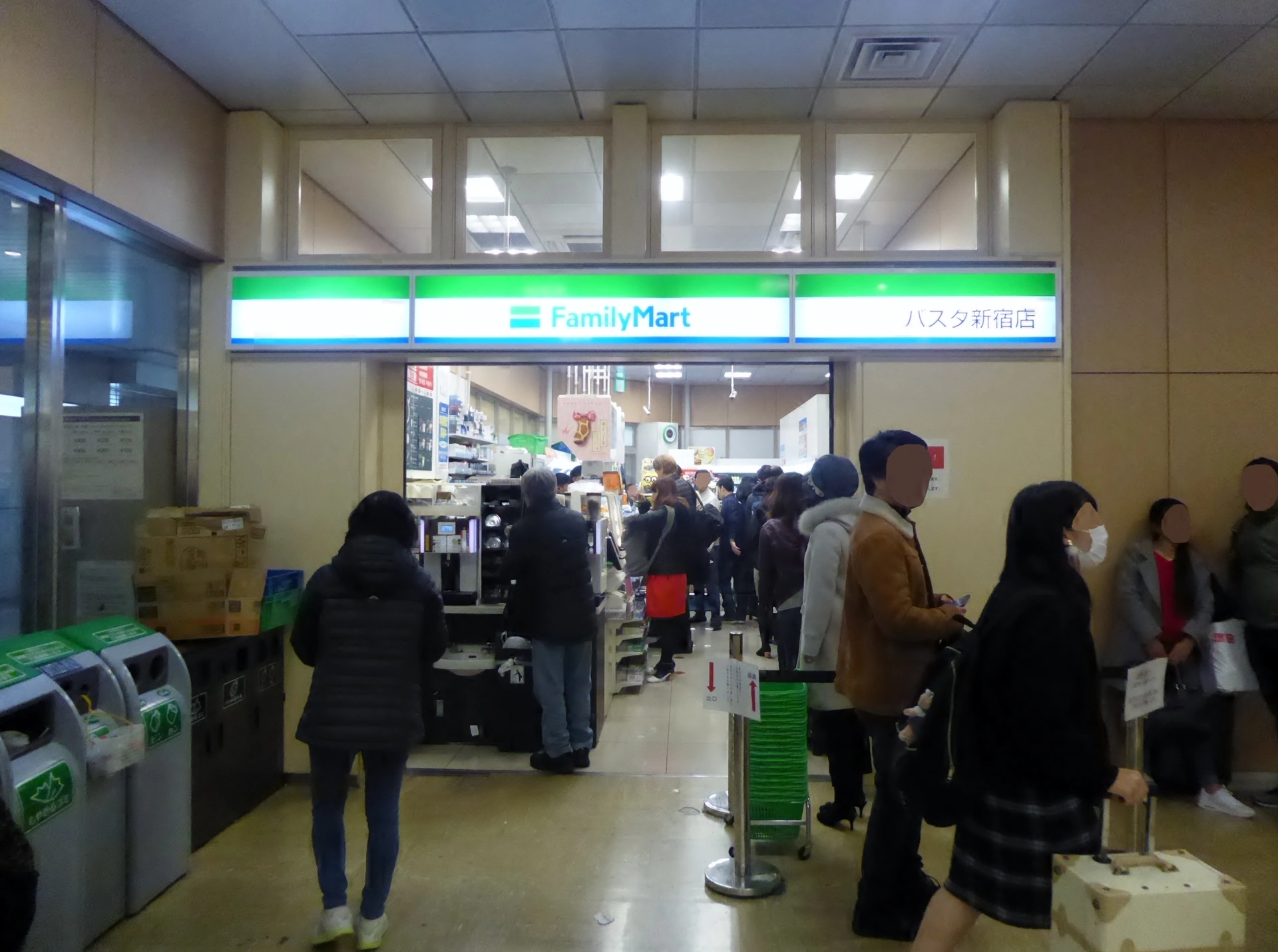 FamilyMart BUSTA Shinjuku storefront with green-and-blue branding — typical FamilyMart layout used for anime collab stores
