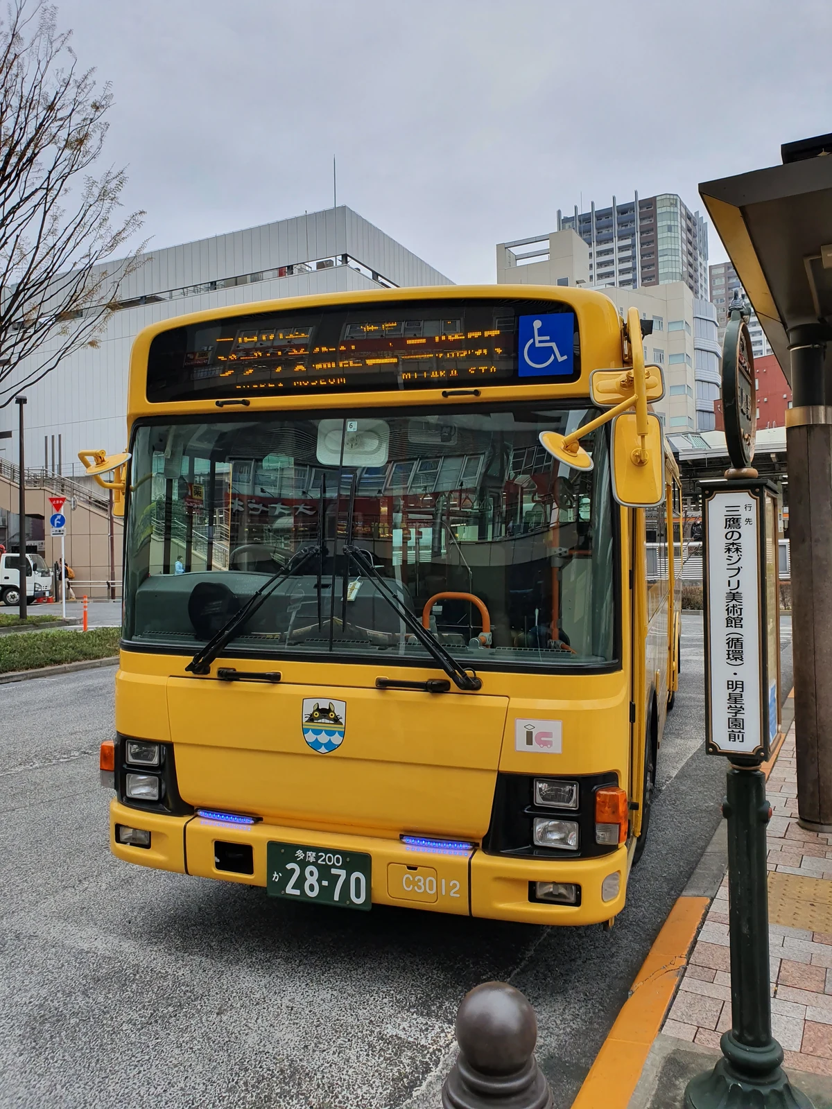 Mitaka City Bus C3012 in special Ghibli Museum livery at Mitaka Station Bus Stop 9 — the 5-minute community bus alternative to the 15-minute walk