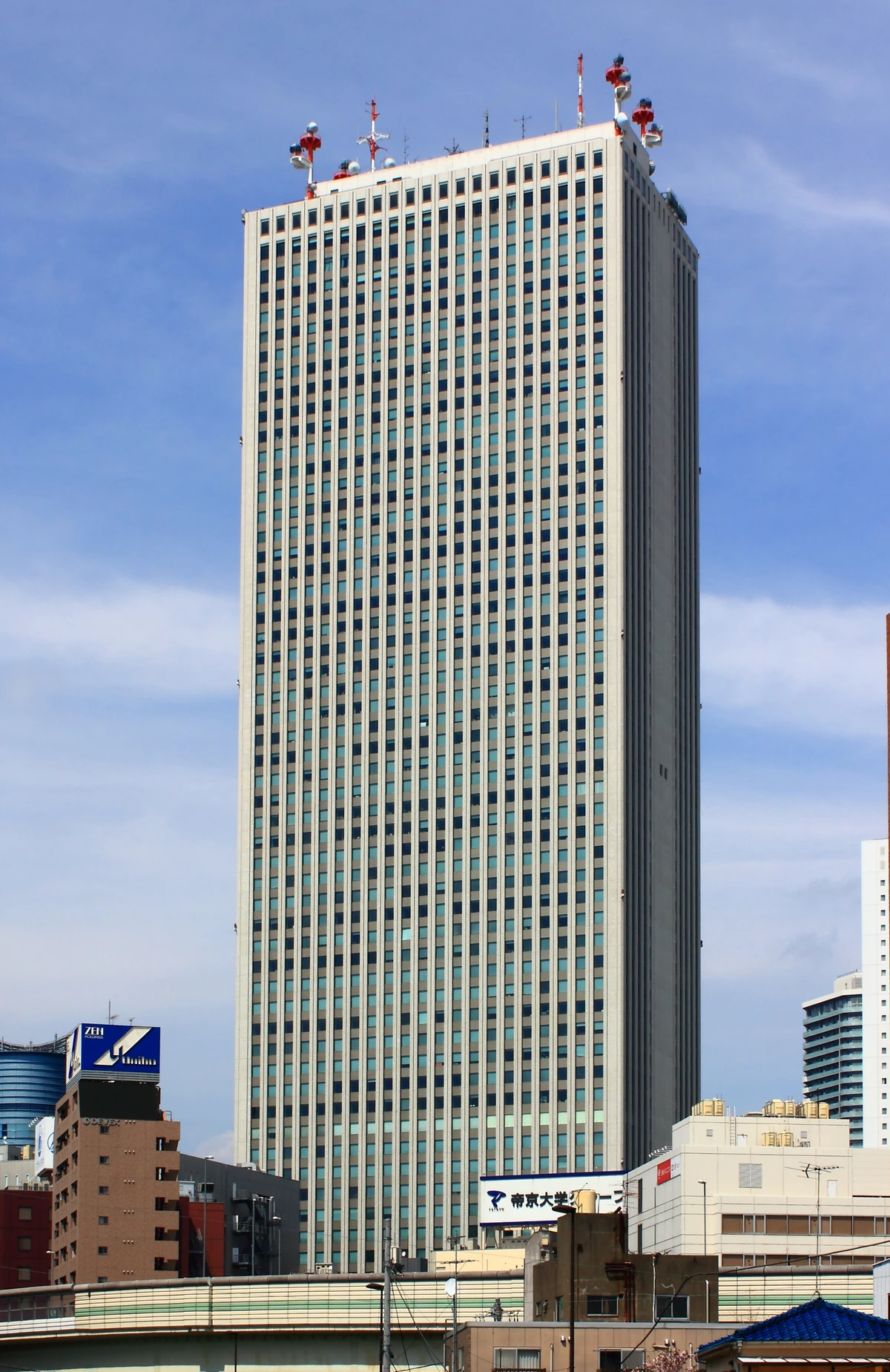 Sunshine 60 skyscraper rising over Ikebukuro, the home district of the Buster Bros!!! division featured in the Hypnosismic Sweets Paradise round 8 menu