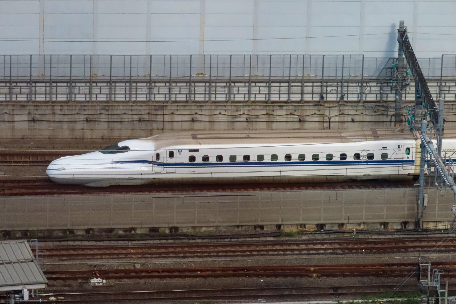 Tokyo Station Shinkansen platform with N700-series train at Track 18 — illustrative reference for current JR Pass coverage