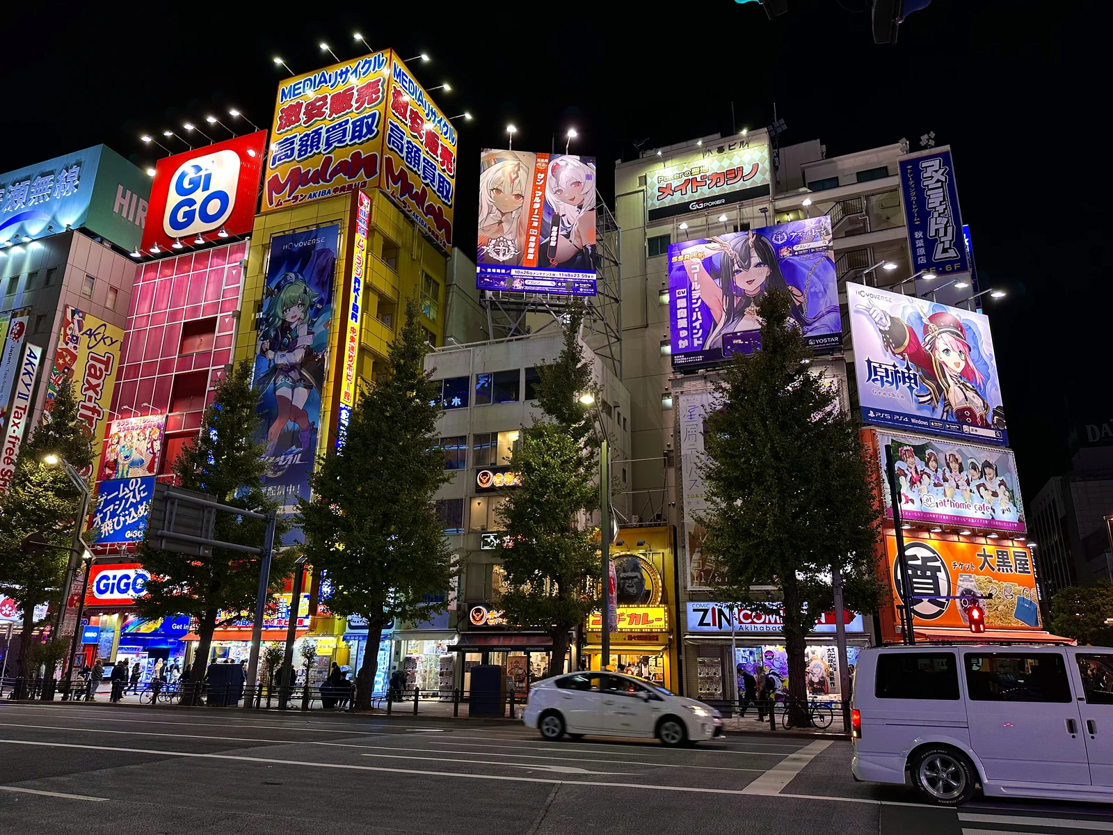 Akihabara Electric Town Sotokanda block at night lit up with anime billboards and arcade signage
