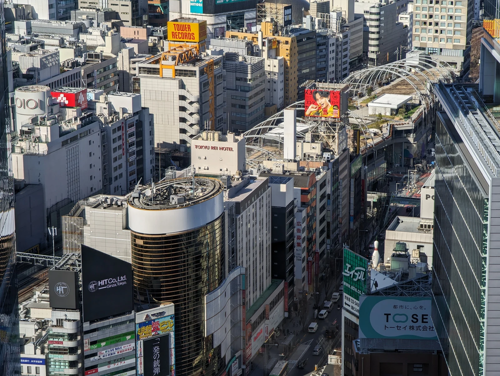 Miyashita Park elevated multi-level park complex in Shibuya — the modern architecture appears as part of the expanded barrier zone in JJK Shibuya Incident