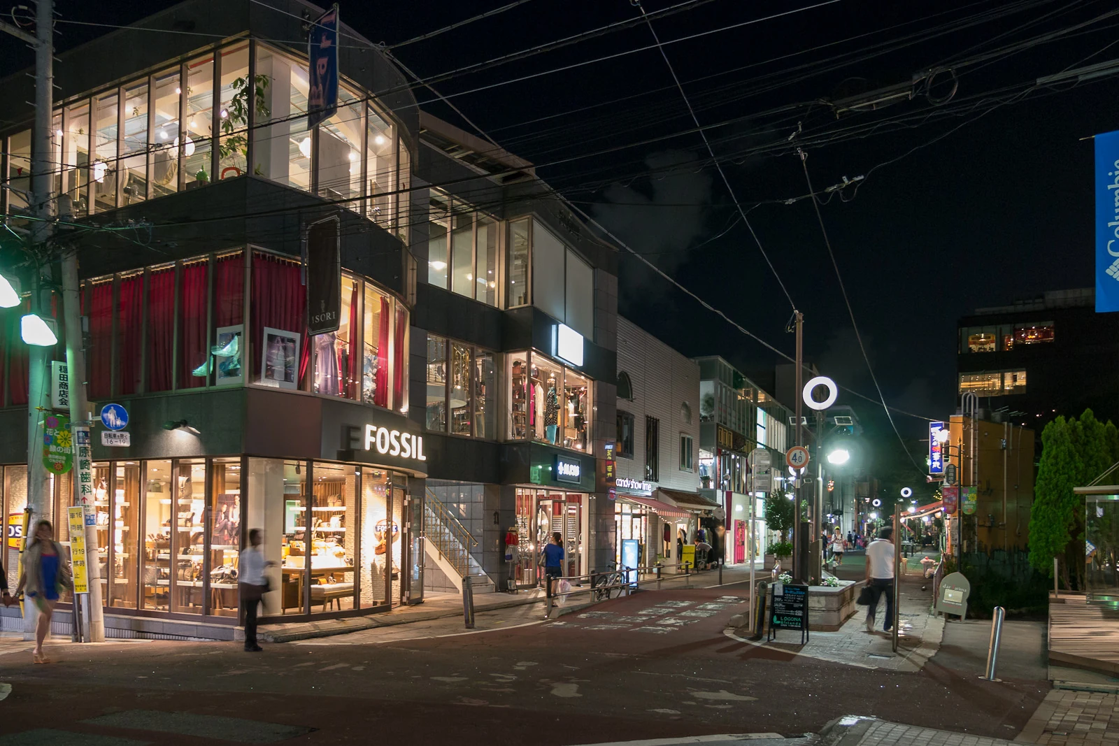Cat Street in Harajuku at night with boutique storefronts and quiet pedestrian flow