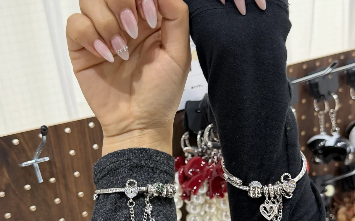 Two friends wearing custom snake bracelets at LuvLab