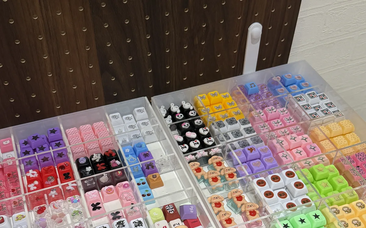 Wall of colorful custom keycaps at LuvLab