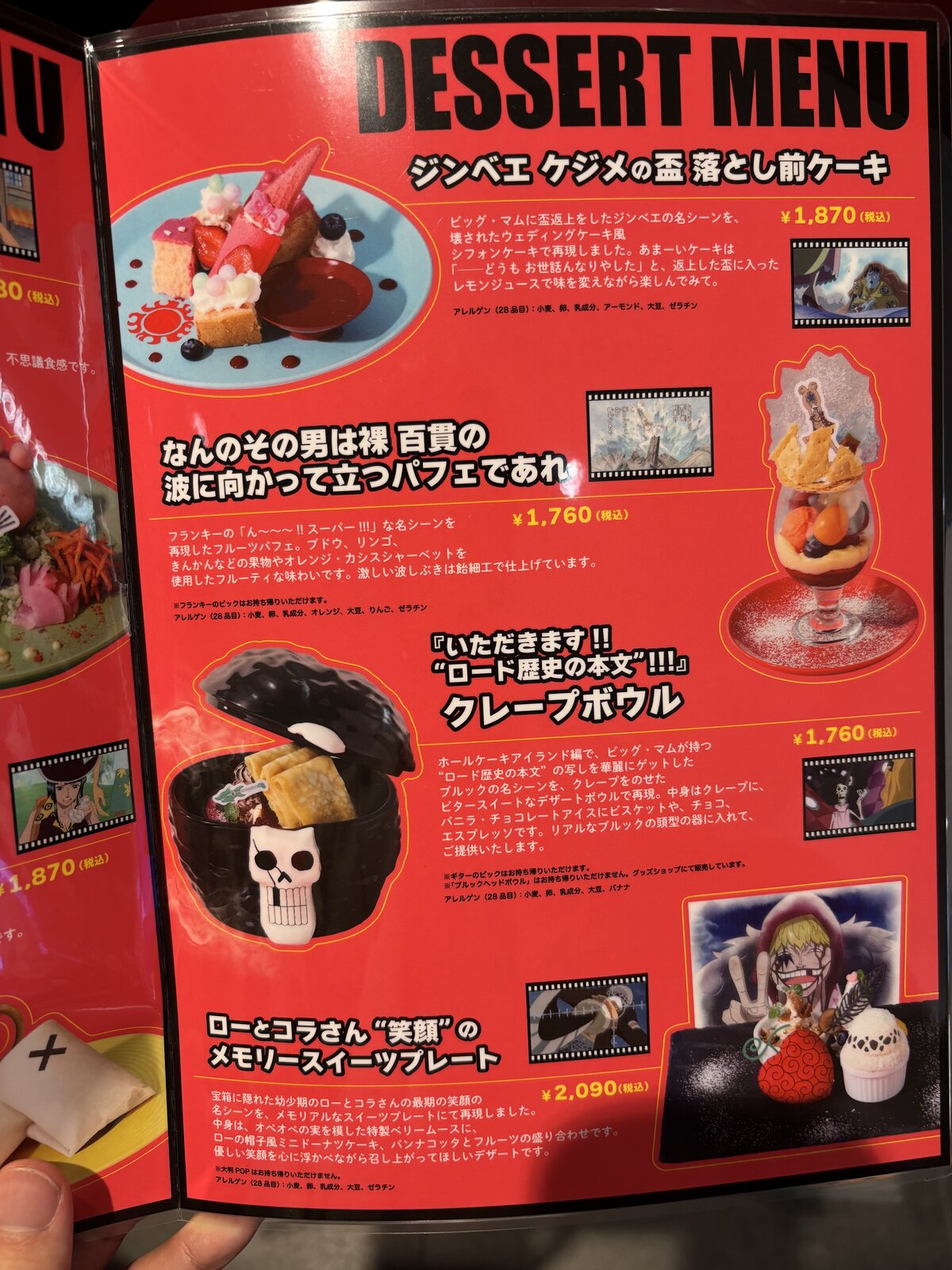 Dessert menu board at One Piece Cafe GENE showing Jinbe Cake, Parfait, Crepe Bowl, and Law and Corazon Memory Sweets Plate with prices