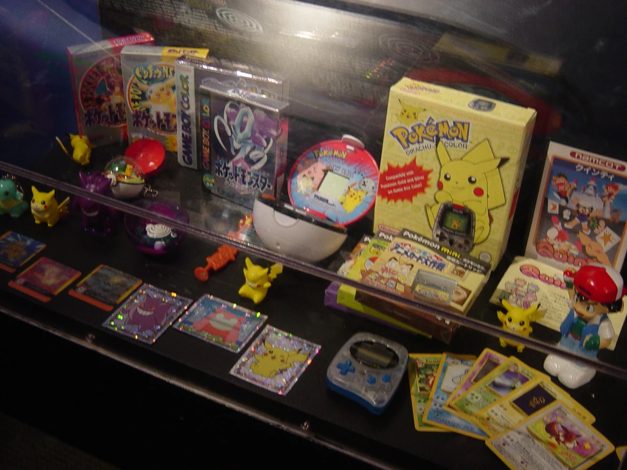 Pokemon merchandise display with Pikachu and other Pokemon plush, illustrative reference for the 2026 Karaoke Manekineko collab pack-plan random-draw merch