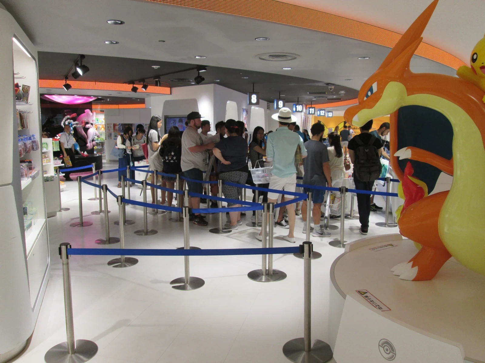 Pokémon Center Mega Tokyo plush and figure displays, comparable themed retail to PokéPark's Entrance Square exhibits