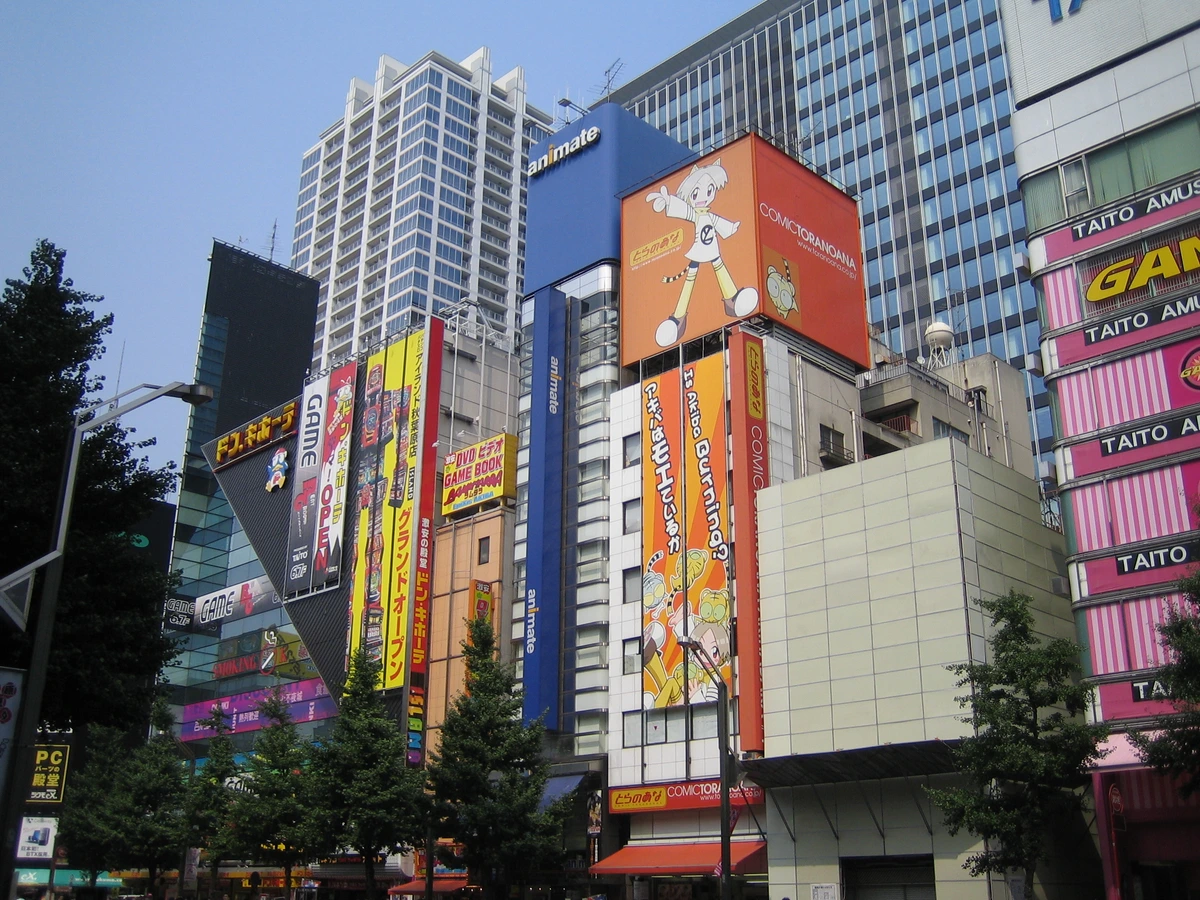 Akihabara Buildings showing the dense skyline of DVD, video game and arcade stores that frame the Cure Maid Café Re:Zero half-day plan